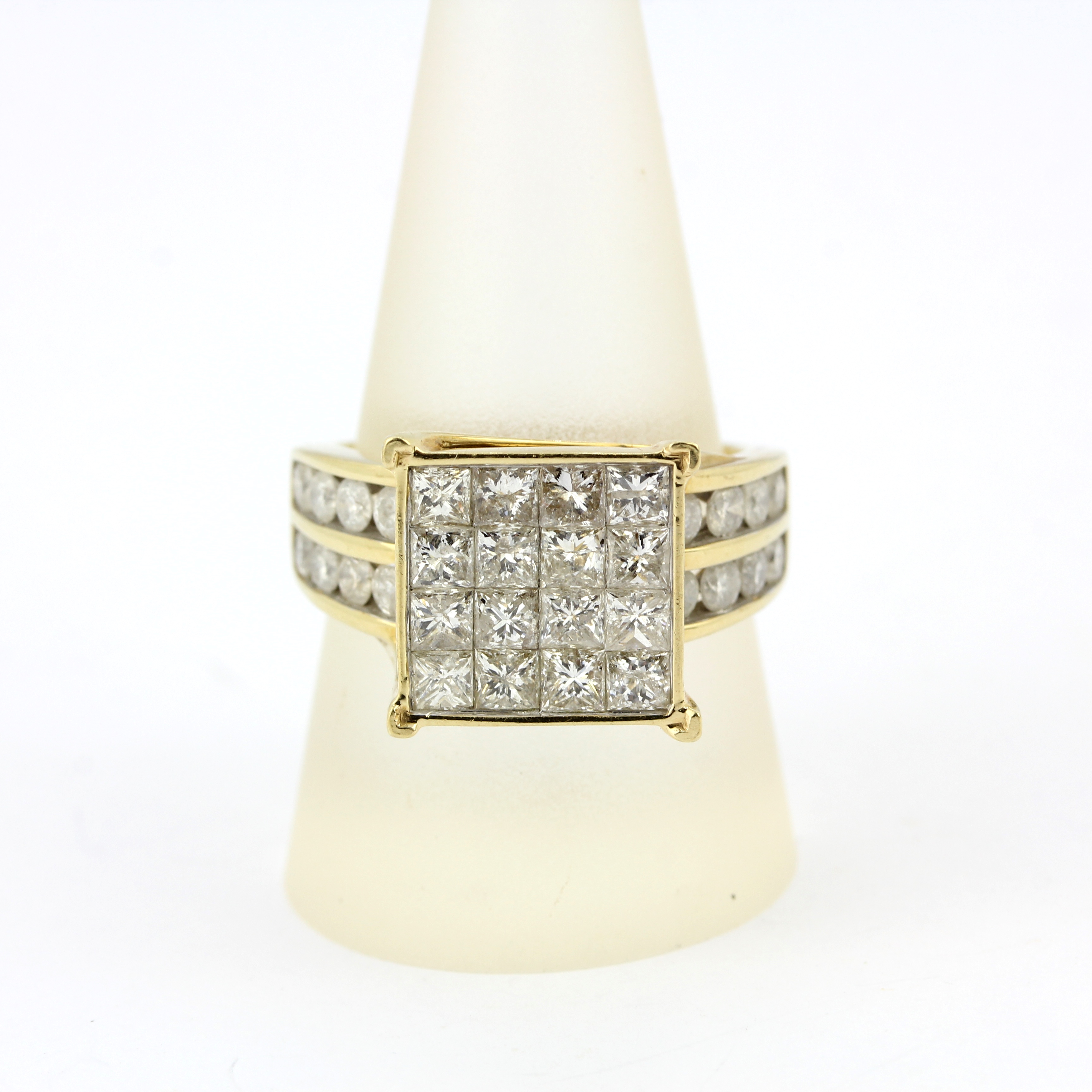 A 9ct yellow gold ring set with princess and brilliant cut diamonds, approx. 4ct overall, ring