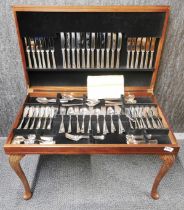 A leather topped coffee table cased silver plated cutlery set.