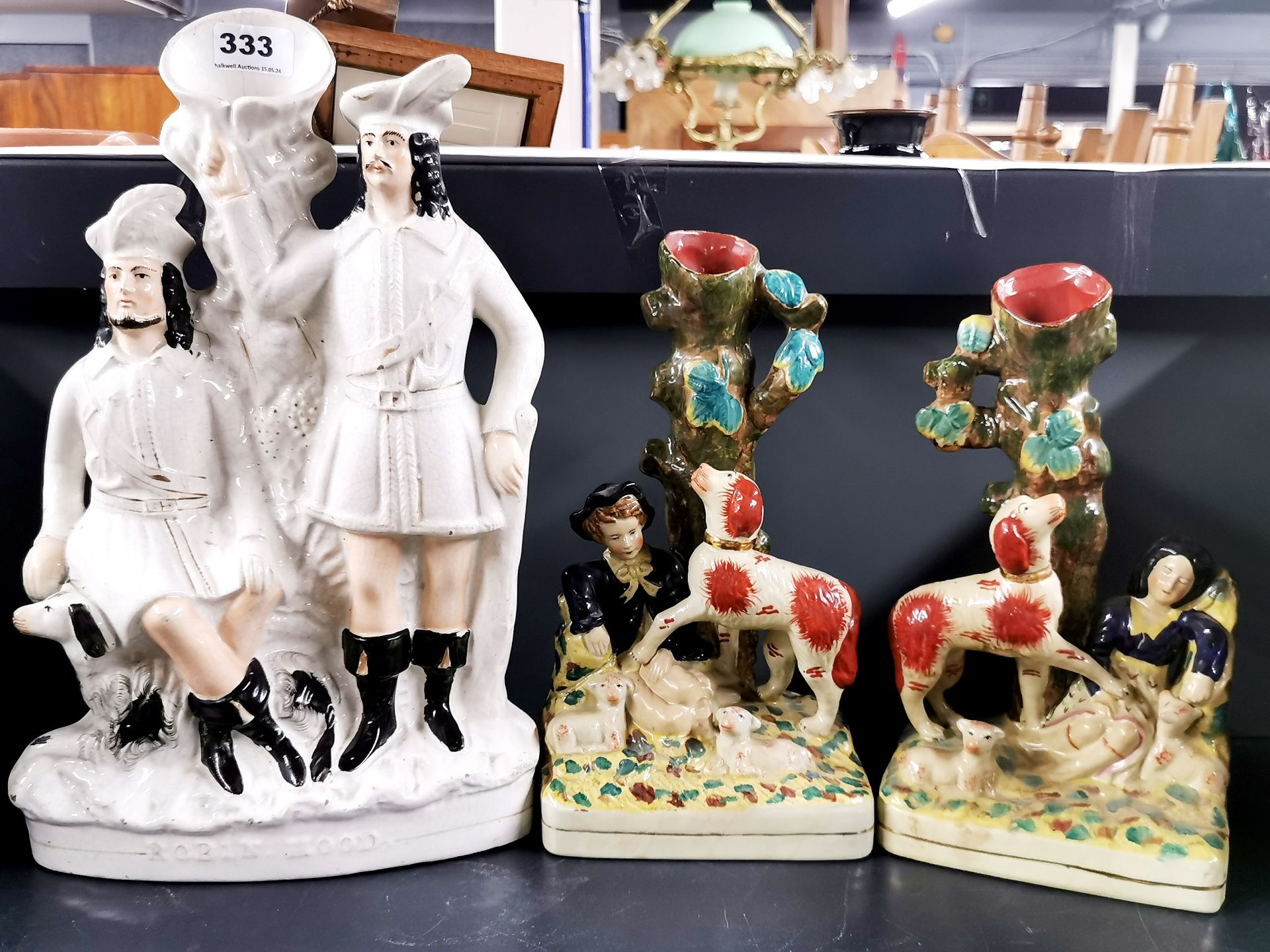 A large 19thC Staffordshire figure, H. 39cm. Together with a pair of Staffordshire style figures.