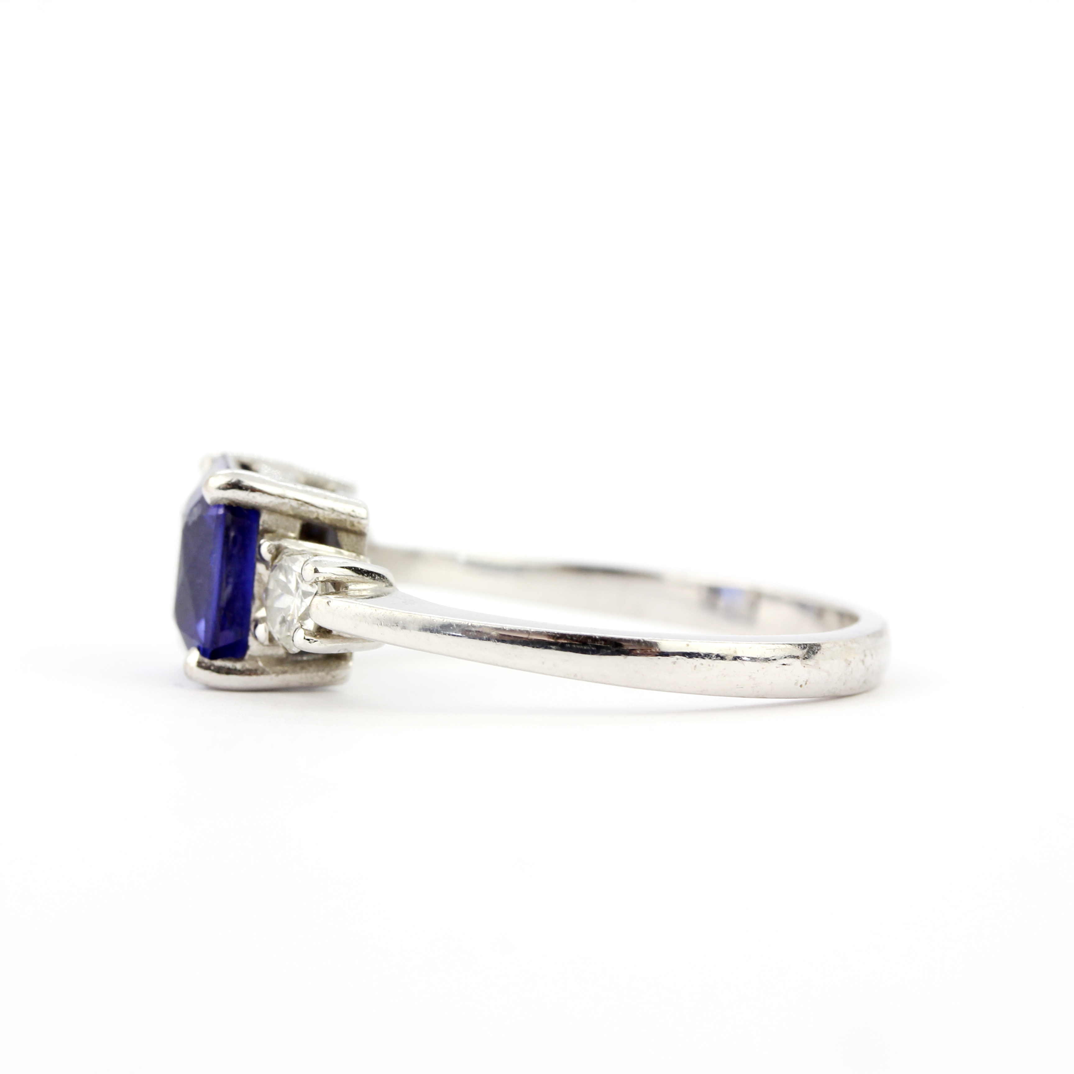 An 18ct white gold ring set with a fancy cut sapphire flanked by brilliant cut diamonds, diamonds - Image 4 of 4