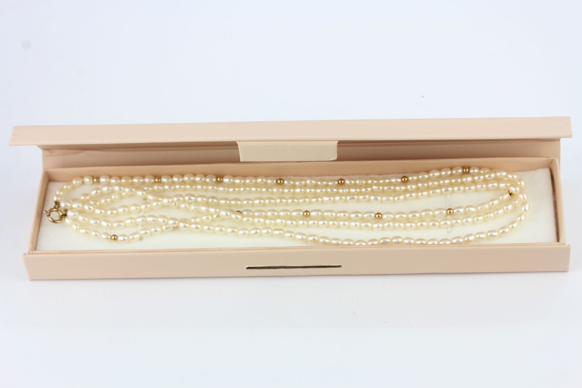 A 9ct yellow gold three row necklace, L. 40cm. - Image 2 of 2