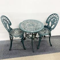 A cast iron garden table and two chairs, table 60 x 63cm.