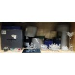 A group of boxed Swarovski crystal items including candle holders and a Santa Maria Galleon,
