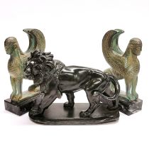 A 19thC French spelter figure of a lion signed Coinchon, L. 22cm, H. 17cm. Together with a pair of