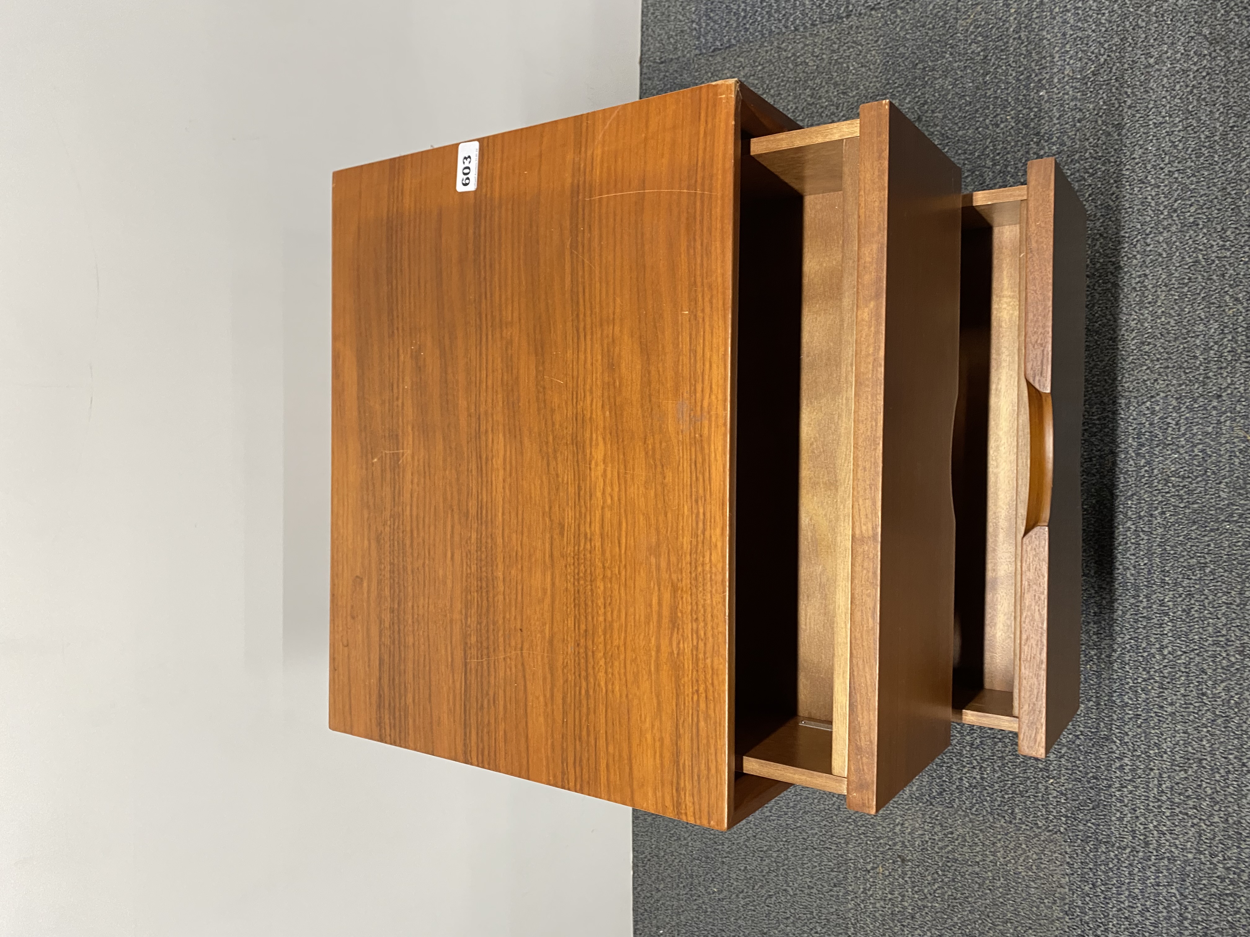 A contemporary teak finished three drawer chest, 50 x 40 x 62cm, with a chrome plinth. - Image 2 of 2