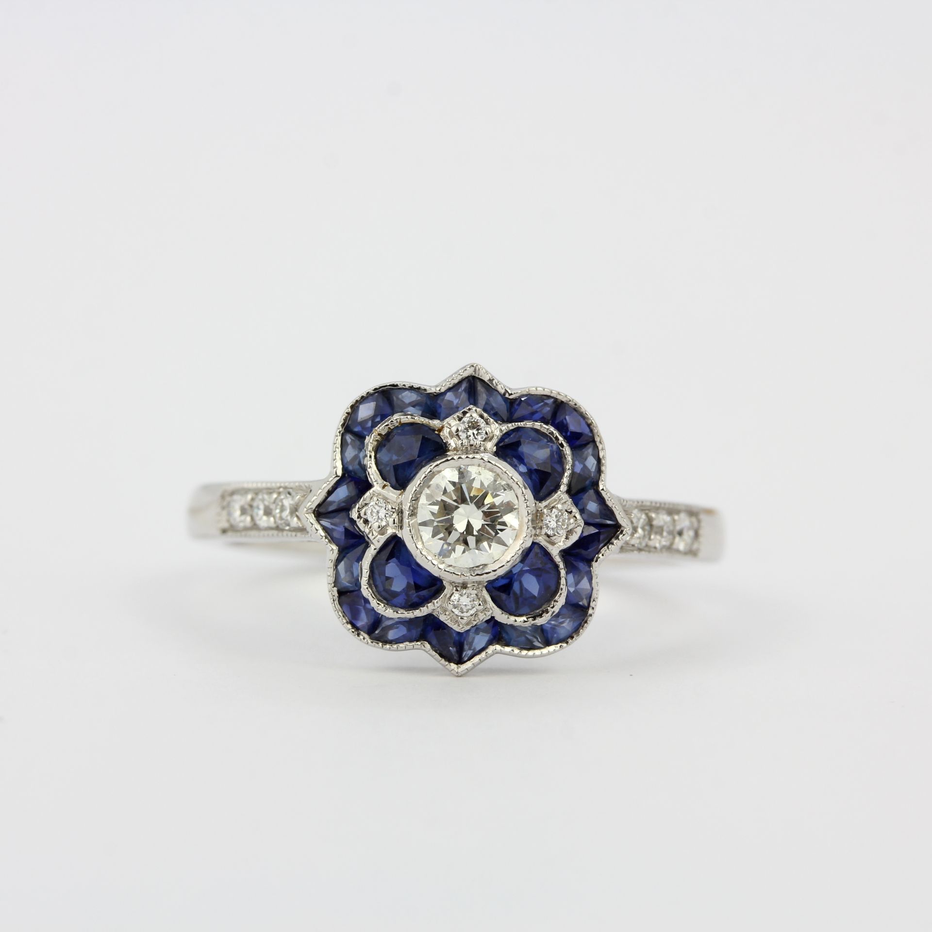 An 18ct white gold Art Deco style ring set with fancy cut sapphires and diamonds, ring size P. - Image 2 of 3
