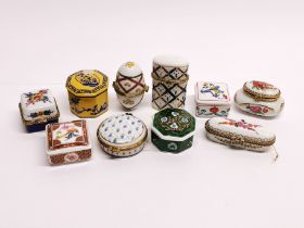 A group of mixed porcelain pill boxes.