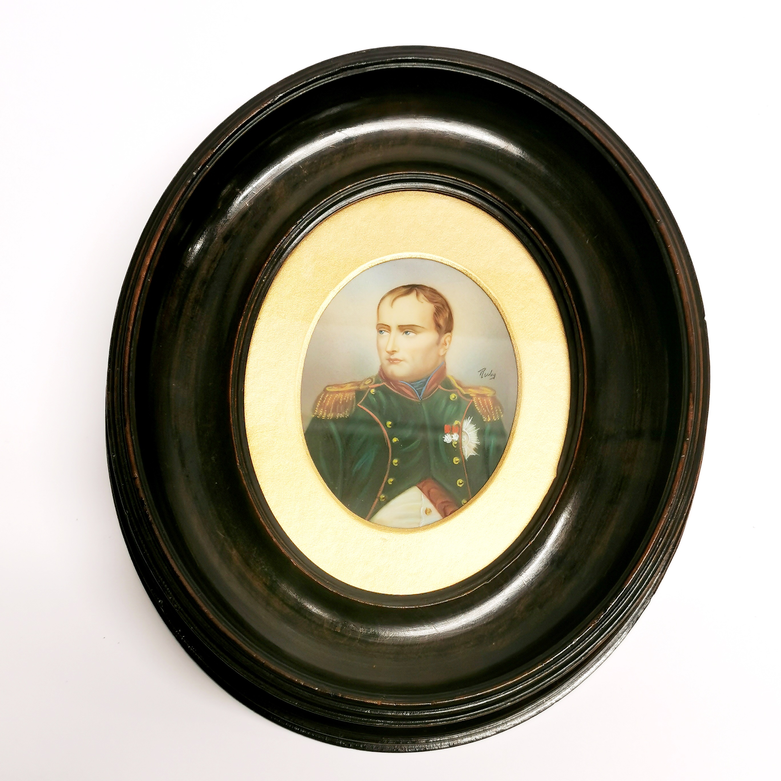 A framed hand painted portrait miniature of Napoleon Bonaparte, signed 'Ruby', frame H. 22cm.