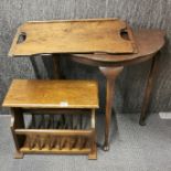 A vintage oak magazine rack with a hall table and folding tray.