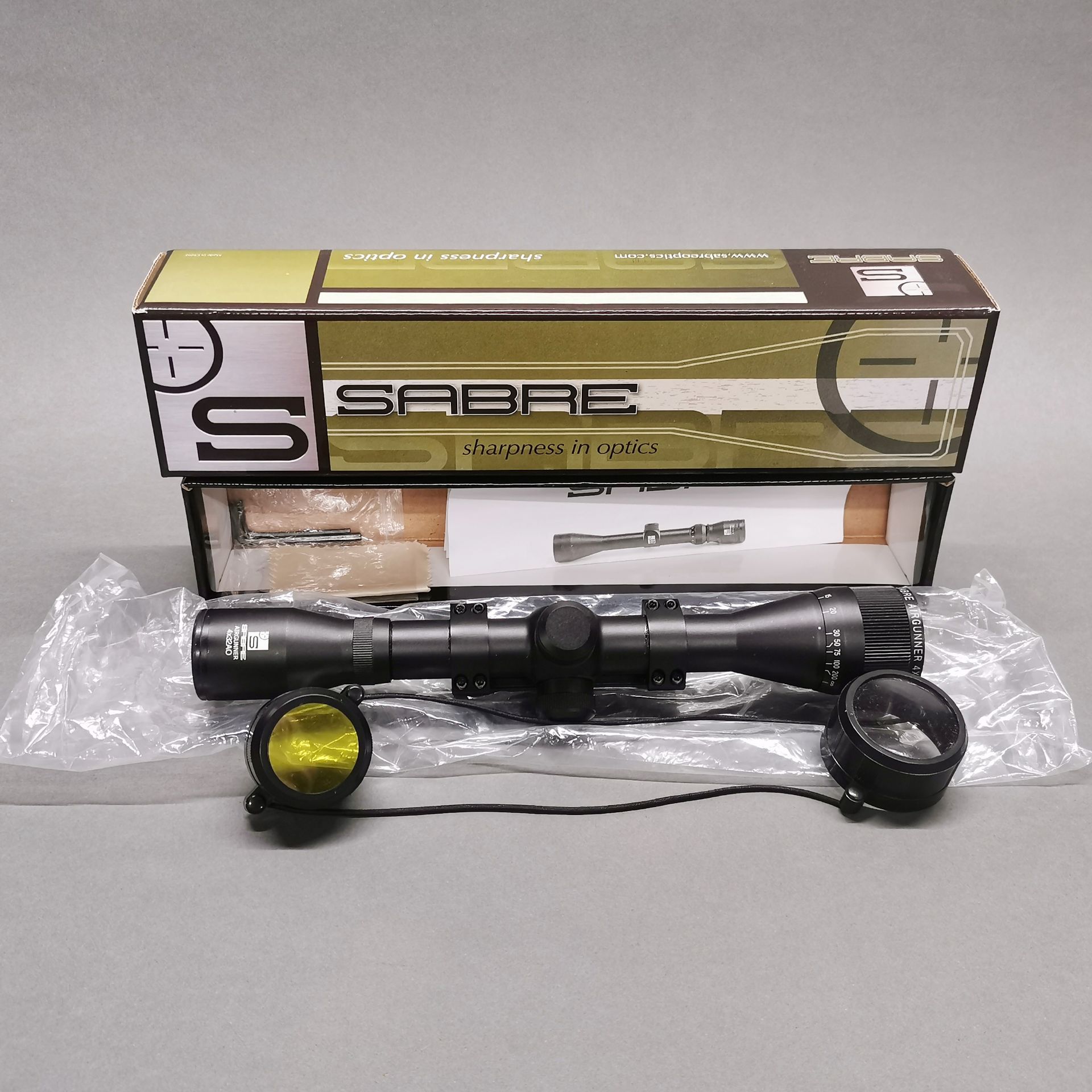 A boxed sabre optics air gun, 4X32AO telescopic sight.