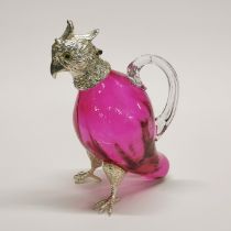 A silver plated and glass bird liqueur decanter with glass eyes, H. 17cm.