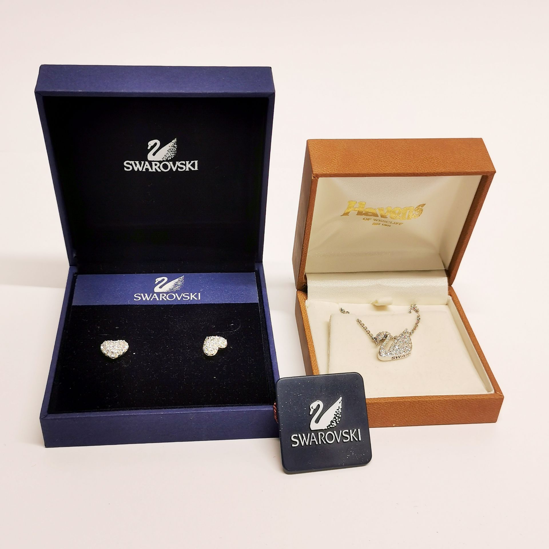 A boxed Swarovski necklace and a pair of earrings.