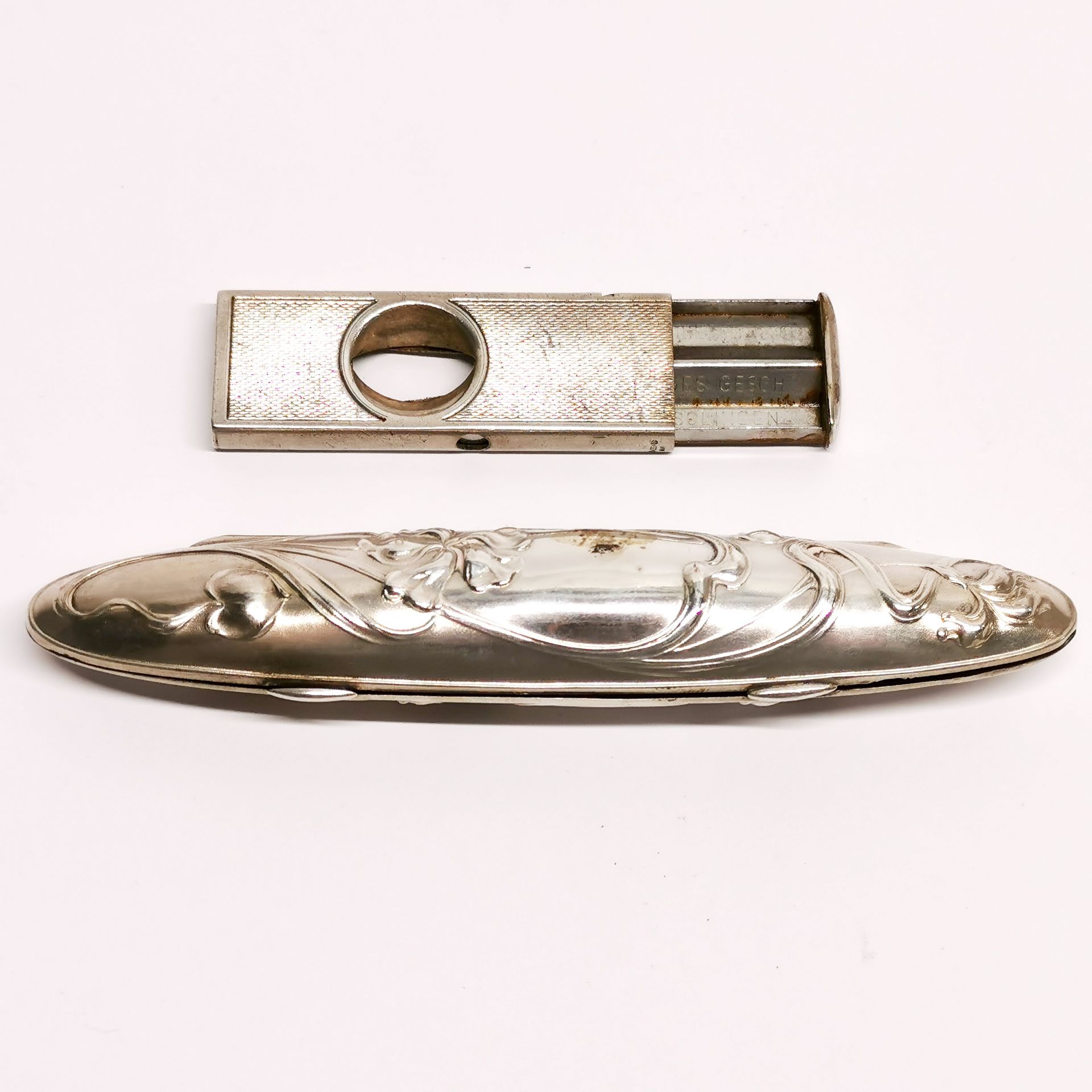 An Art Nouveau design cigar case, L. 12cm, together with a cigar cutter. - Image 2 of 2