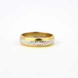 An 18ct yellow and white gold ring, ring size U.