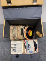 A quantity of 45-RPM single records.