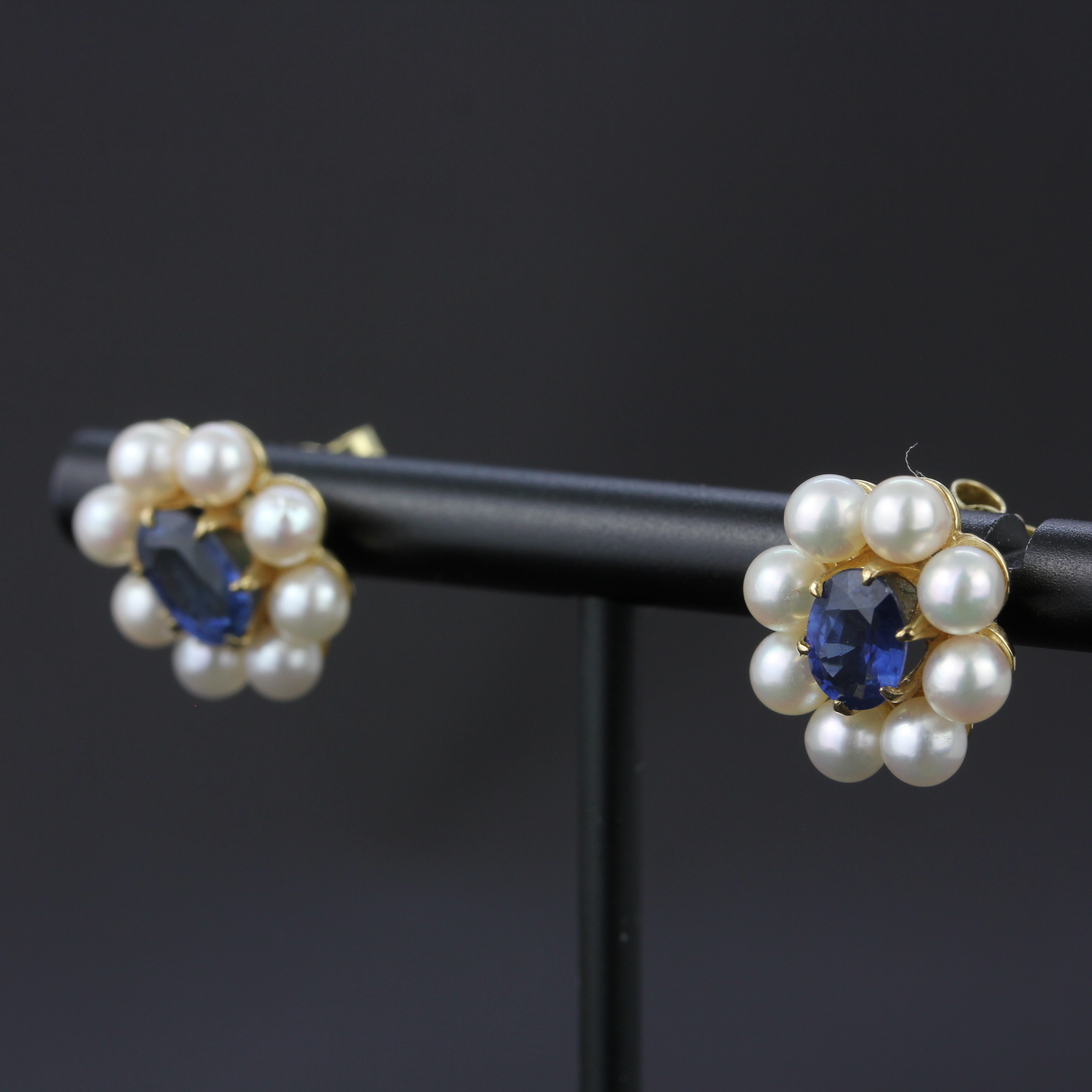 A pair of 9ct yellow gold earrings set with oval cut sapphires surrounded by pearls, L. 1.3cm. - Image 3 of 4