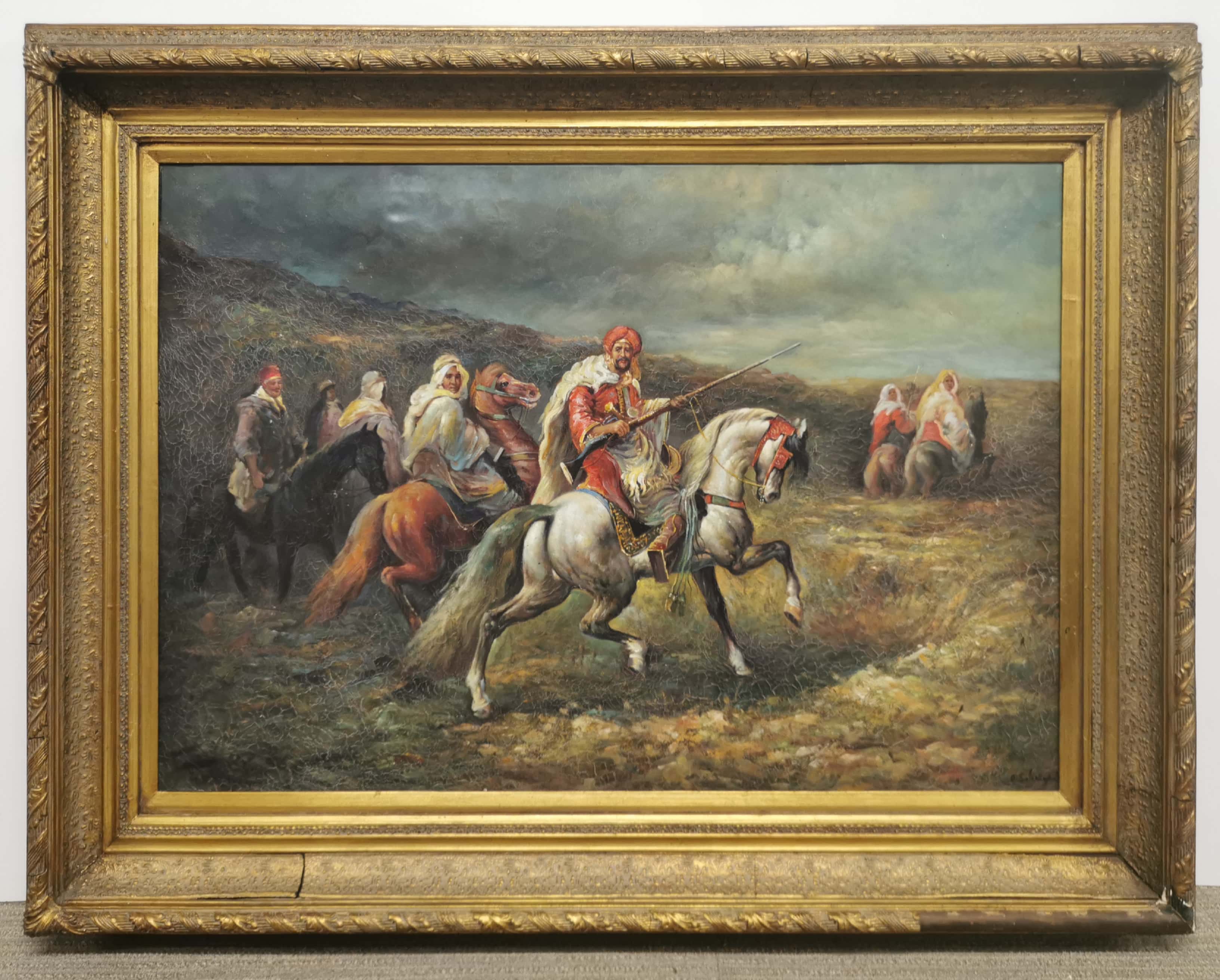 A large gilt framed oil on canvas of Arab horsemen, after D. Salanger, frame size 115 x 87cm.