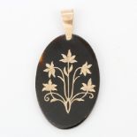 A large c. 1900's picque 9ct rose gold and tortoiseshell pendant, L. 6.2cm.