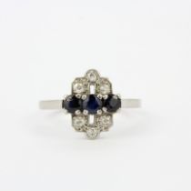 An Art Deco style 18ct gold and platinum ring set with sapphires and diamonds, ring size S.5.