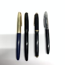 A group of four fountain pens, one with 14ct gold nib.