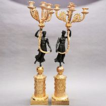 An impressive pair of gilt bronze figural candelabra, H. 72cm.