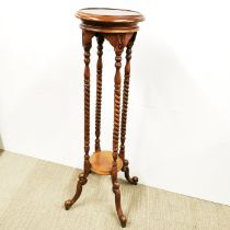A useful turned wooden plant stand, H. 100cm.