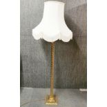 A brass spiral standard lamp and shade, H. 169cm.