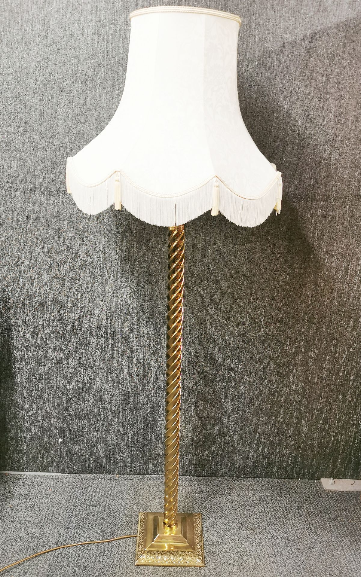 A brass spiral standard lamp and shade, H. 169cm.