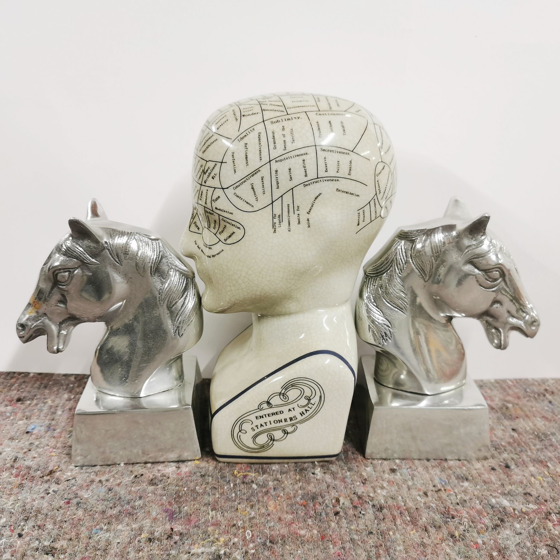 A pair of Art Deco style metal horse head book ends, H. 17cm. Together with a ceramic phrenology - Image 2 of 2