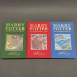 A first edition unsealed hardback Harry Potter and the Chamber of Secrets novel, together with two