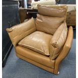 A 1970's Danish Svend Skipper high backed tan leather armchair, H. 100cm, W. 94cm.