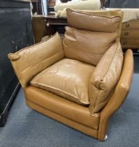 A 1970's Danish Svend Skipper high backed tan leather armchair, H. 100cm, W. 94cm.