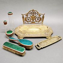 An interesting brass desk stand, width 35cm. With a brass pen tray and an enamelled dressing table