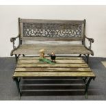 An old cast iron garden bench and table, bench W. 127cm, together with a cast iron William Tell