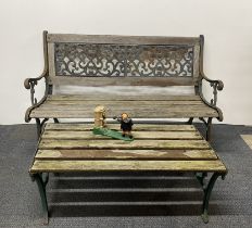 An old cast iron garden bench and table, bench W. 127cm, together with a cast iron William Tell