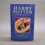 A first edition sealed hardback Harry Potter and the Half blood prince novel.
