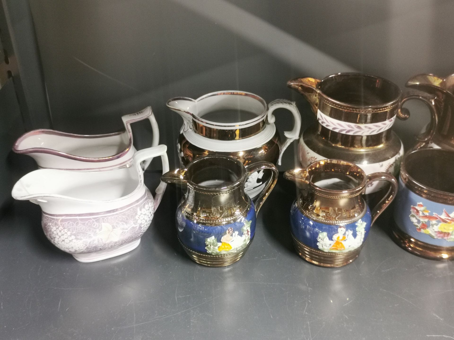 A collection of early lusterware jugs, H.13cm. Together with four plates. - Image 2 of 3