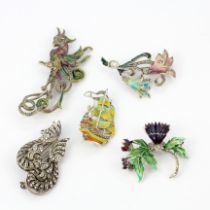 A quantity of costume brooches.