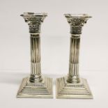 A pair of hallmarked silver column candlesticks, H. 19.5cm.