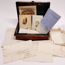 A painted tin box containing a quantity of interesting old ephemera, box size 26 x 17 x 10cm.