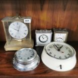 A Kunda 1970's magnetic clock, H. 25cm, together with four further clocks.