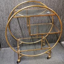 A vintage gilt metal Art Deco style drinks trolley, H. 93cm.