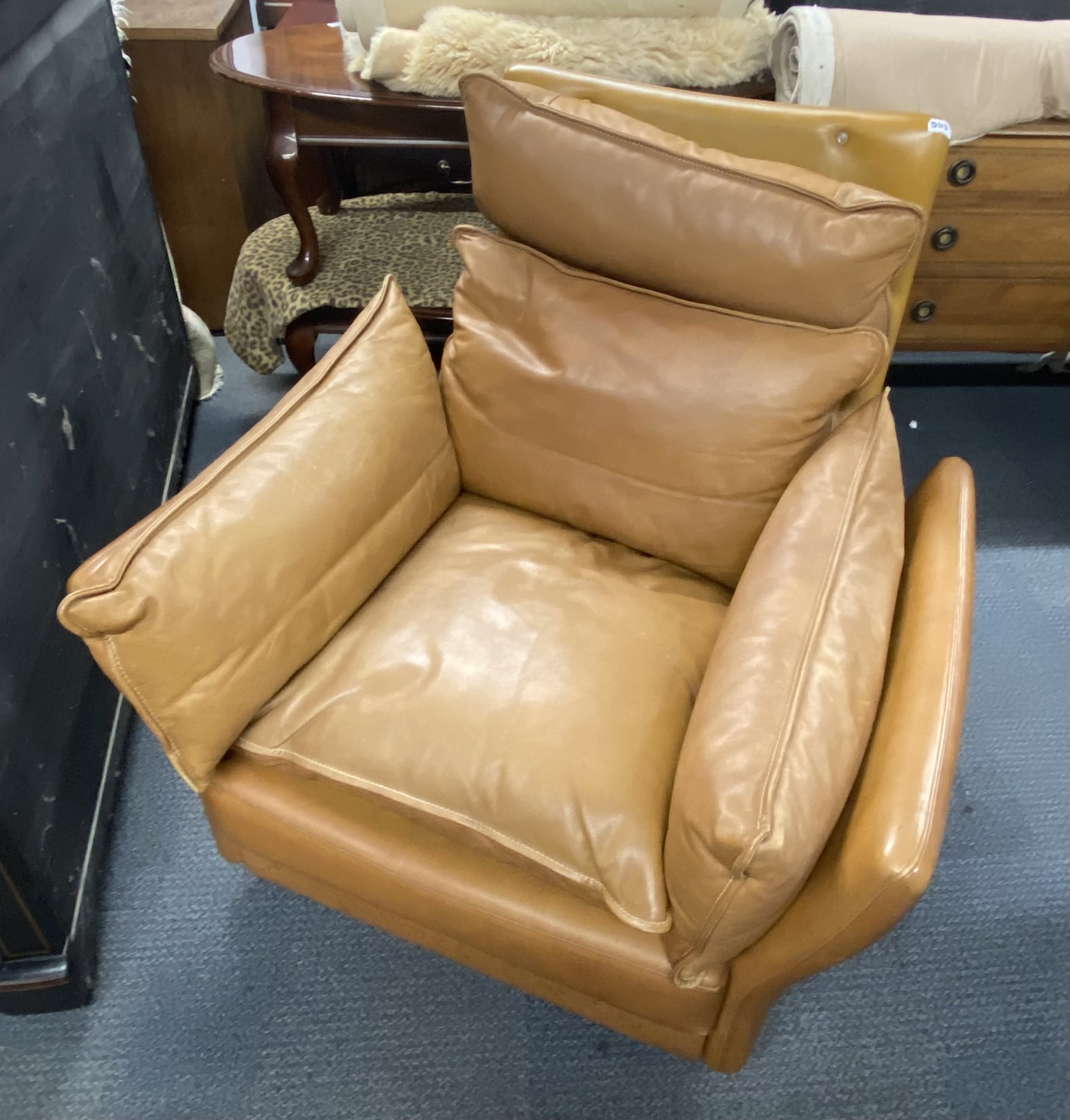 A 1970's Danish Svend Skipper high backed tan leather armchair, H. 100cm, W. 94cm. - Image 2 of 3