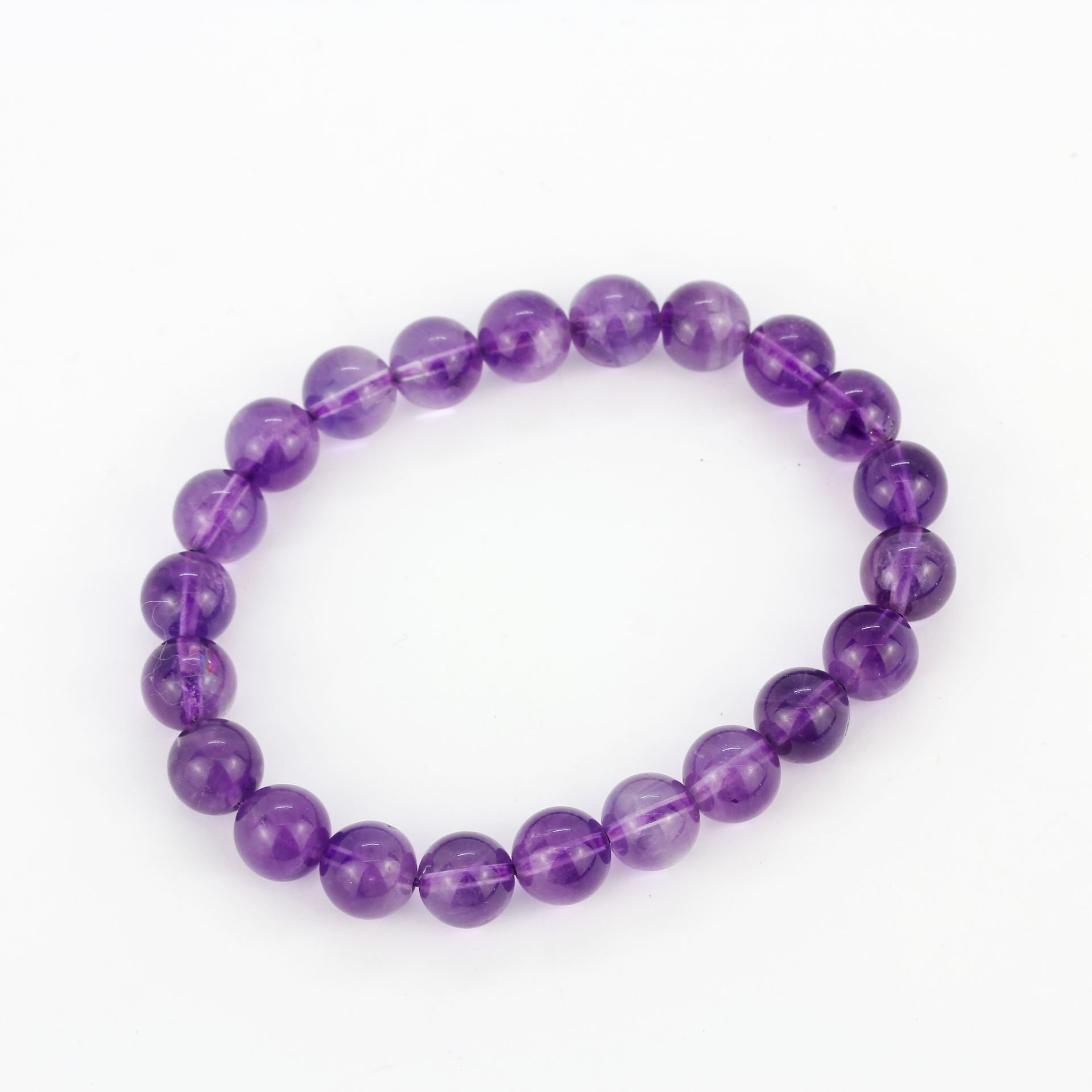 A polished amethyst bead expandable bracelet. - Image 2 of 2