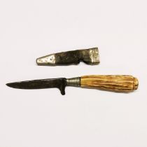 A Scottish antler handled dirk knife with a white metal and leather sheath (A/F)