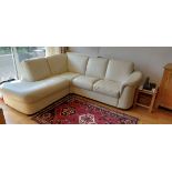 A large Italian cream leather three sectioned sofa.