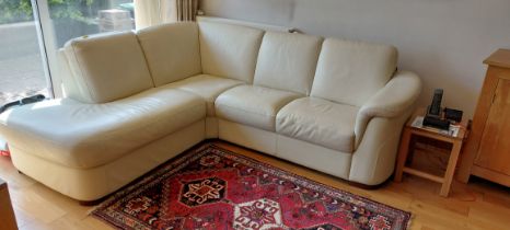 A large Italian cream leather three sectioned sofa.