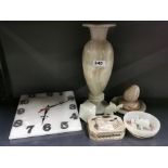 An onyx wall clock, width 20cm. With further onyx items. With a case set of onyx bowls.