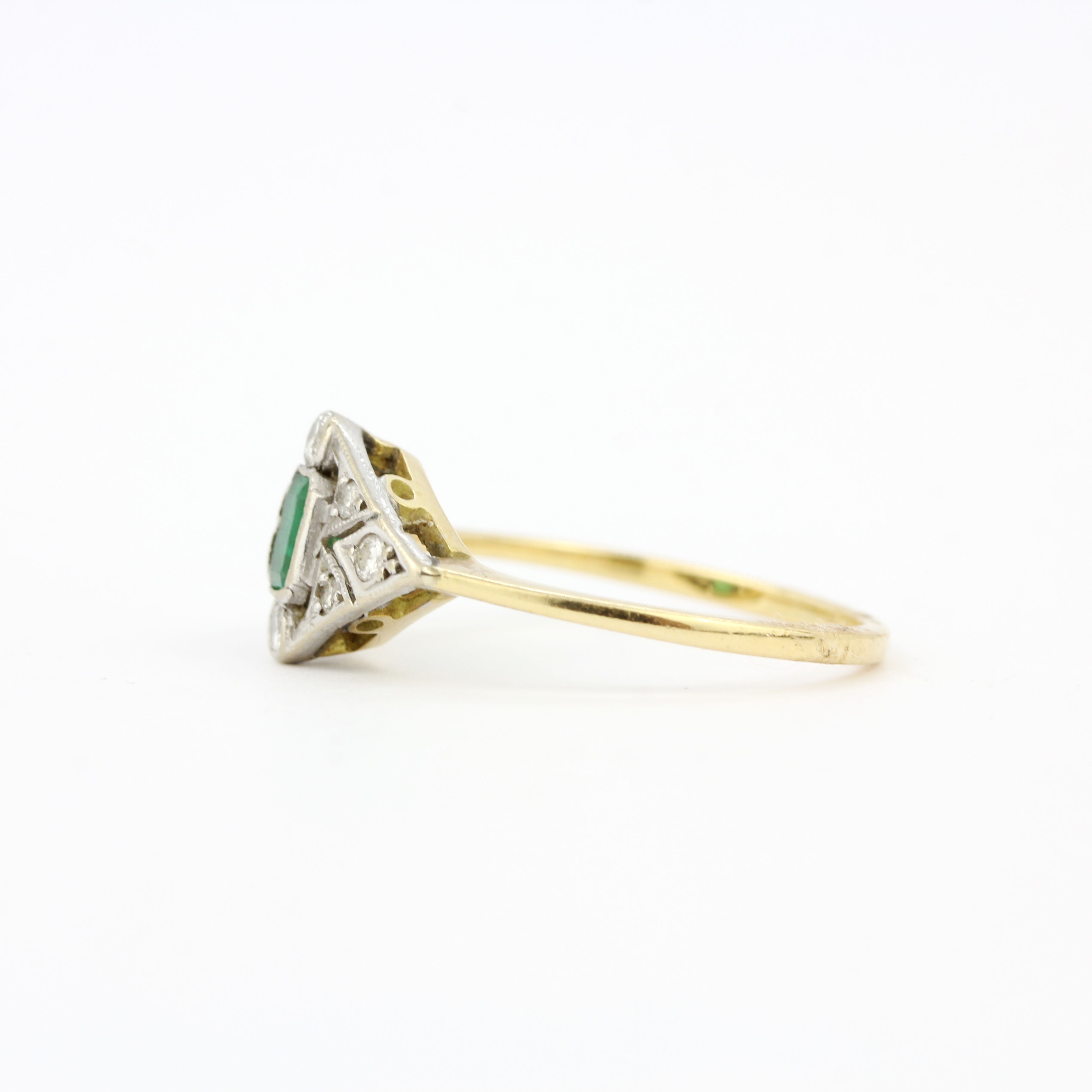 An Art Deco 18ct gold and platinum (worn hallmarks) ring set with diamonds and an emerald cut - Image 3 of 3