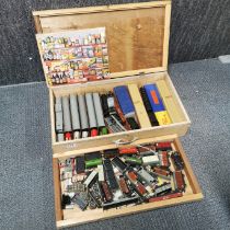 A wooden box and extensive model contents.